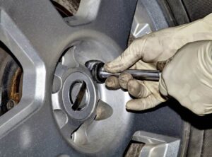 Remove the lug nuts from the wheel