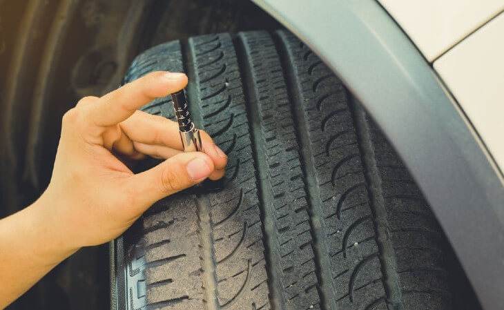 Measuring tread wear on a car tire